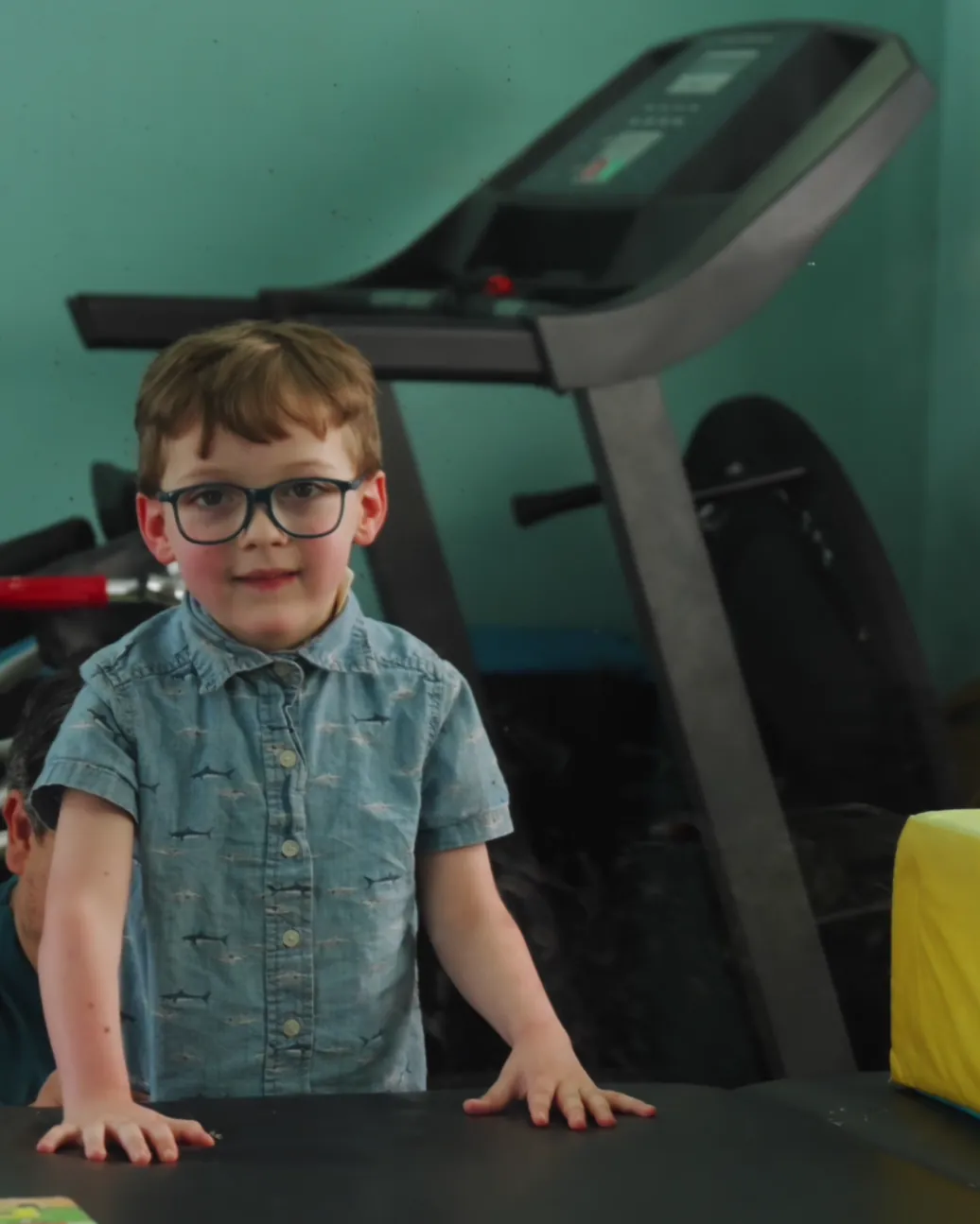 Child participating in a guided mirror-based therapy activity